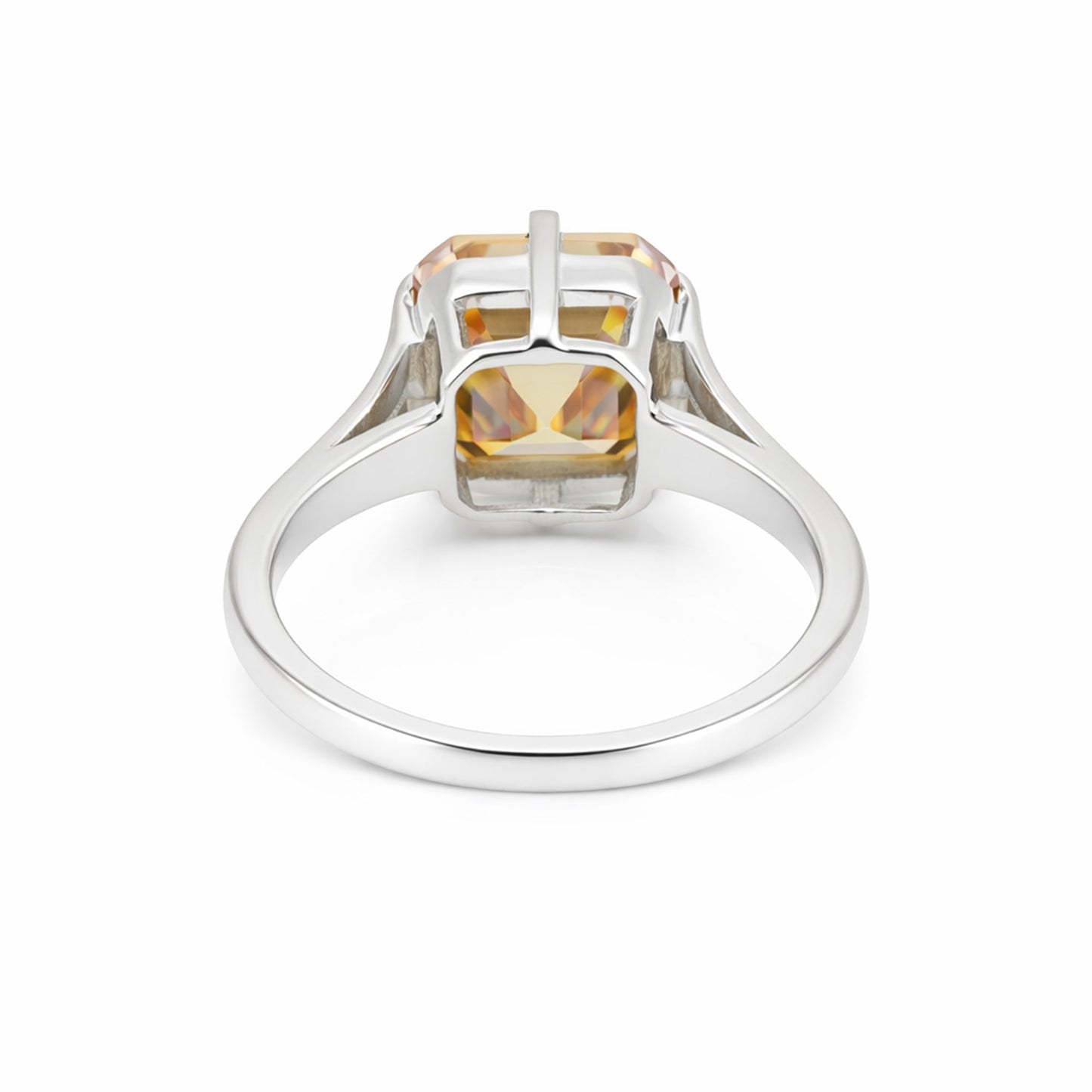 Detail of 18k gold vermeil prongs holding asscher diamond, top-down view