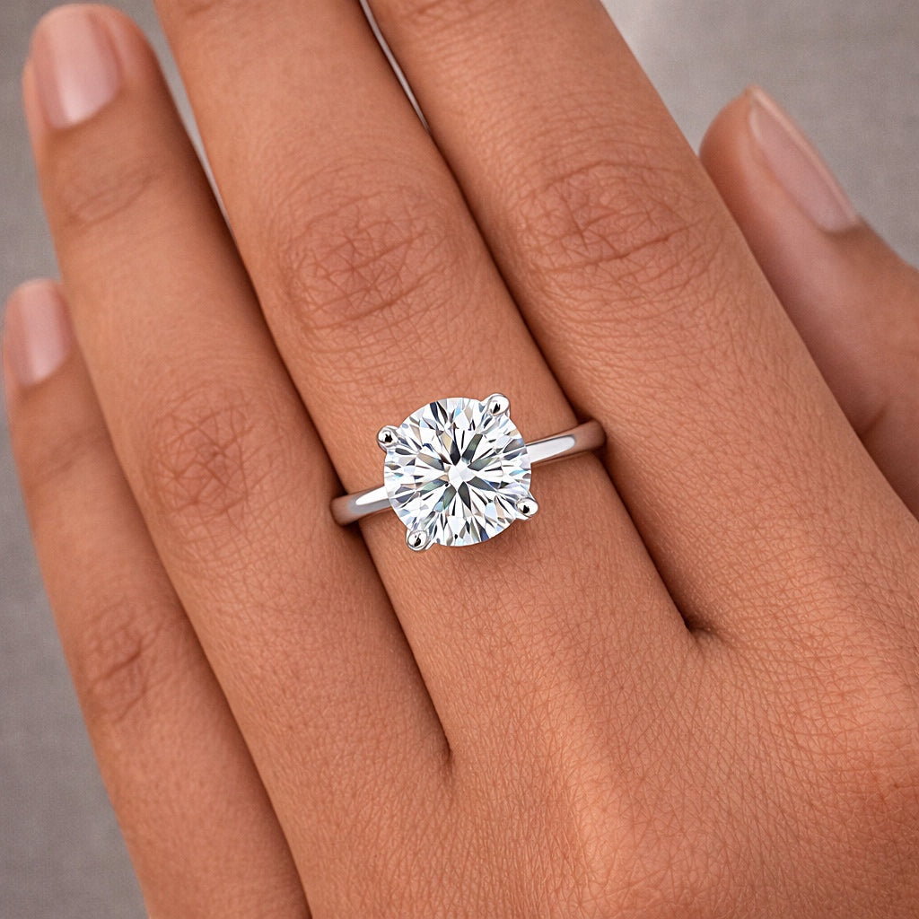 Side profile of 5 carat diamond ring on cathedral gold vermeil shoulders