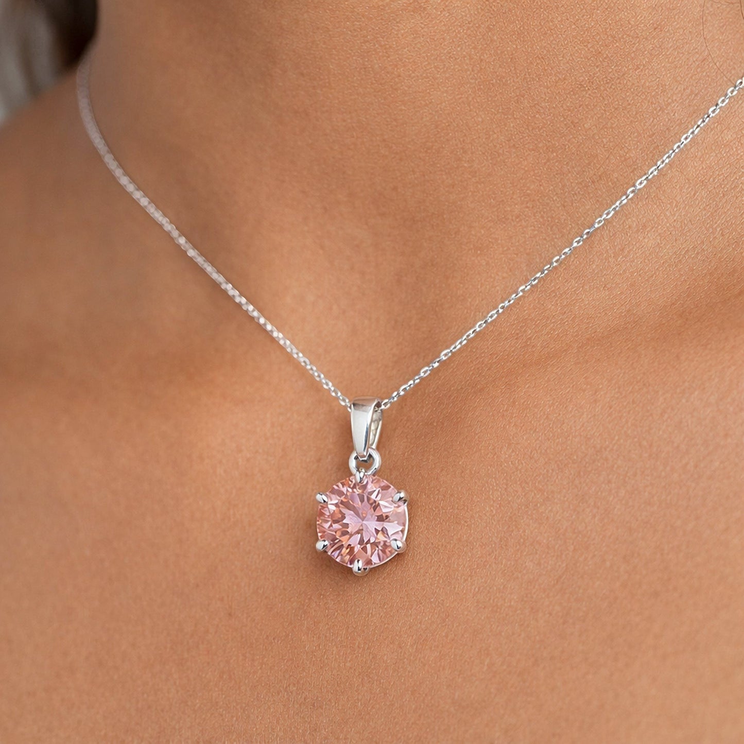 Round-cut pink lab diamond pendant with detailed view of 4-prong vermeil mounting