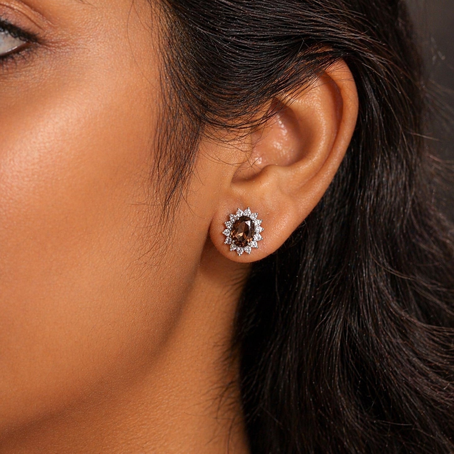 Pair of smoky topaz earrings showing warm brown tones and oval brilliant cut