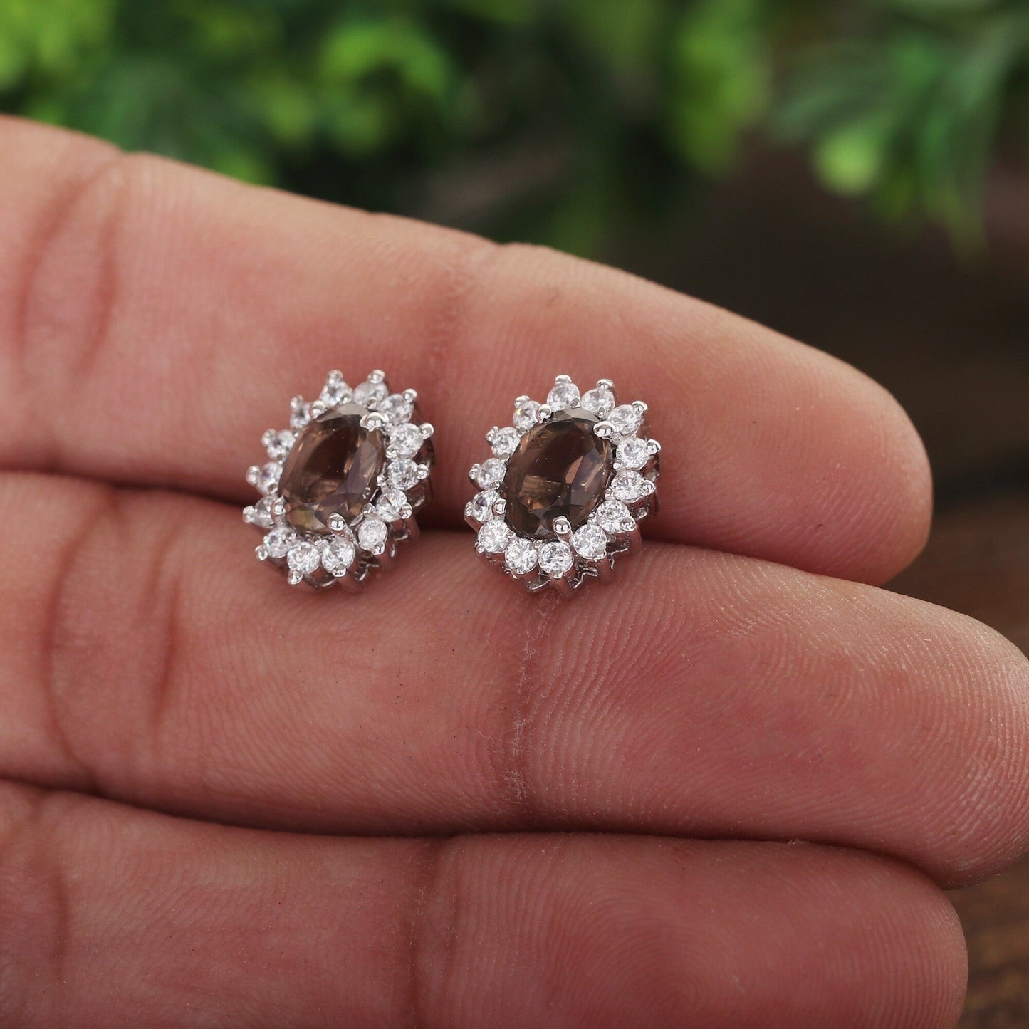 Smoky topaz earrings worn on ear, neutral background, daily-wear styling