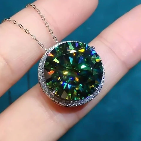 11.50 ct DEW greenish blue moissanite solitaire halo pendant in 18K gold vermeil, held in hand to show scale and fire – GEMHUB