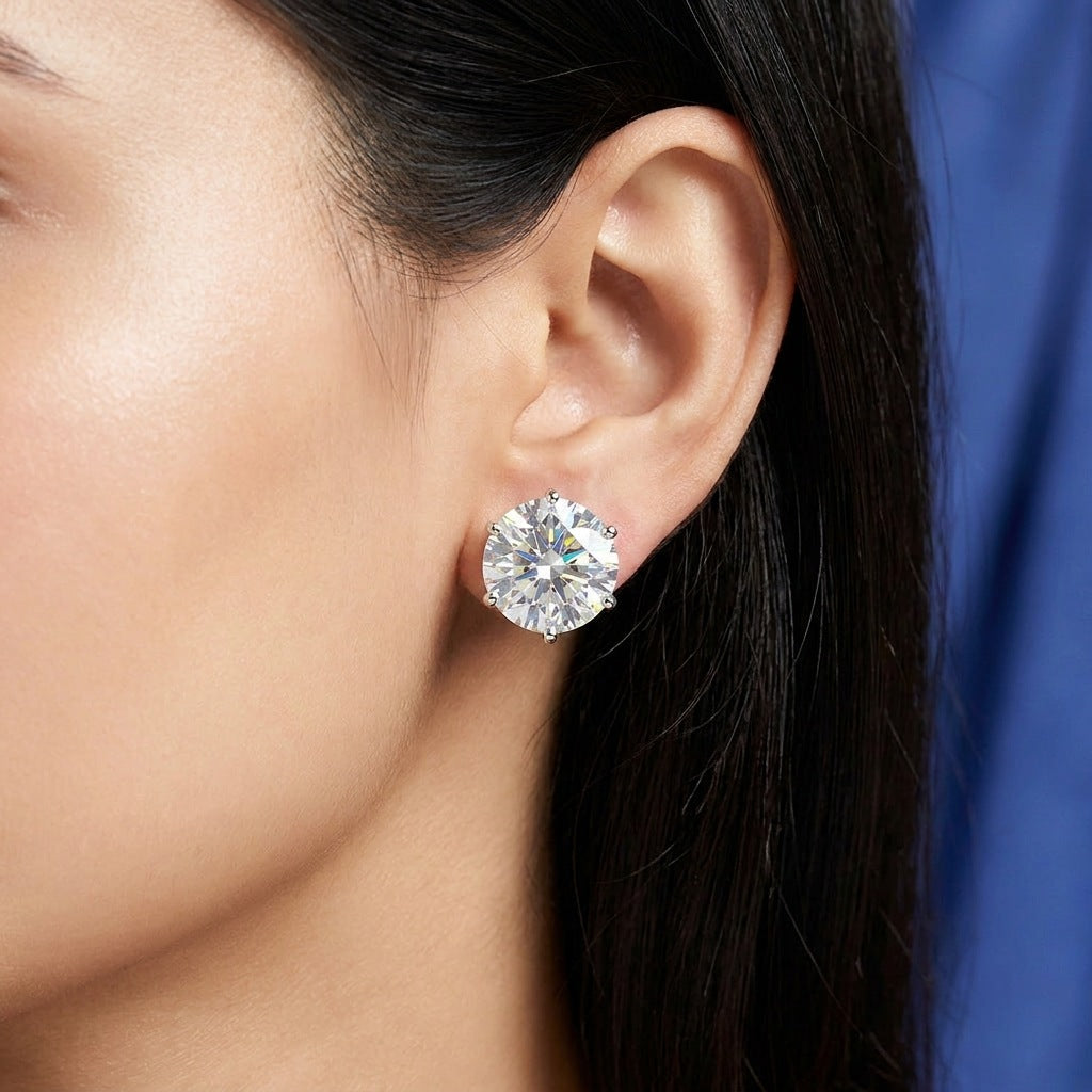 Close-up of round moissanite stud on the earlobe