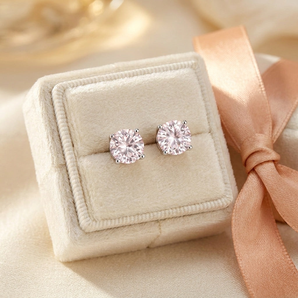 Pair of pale pink moissanite studs in a gift box