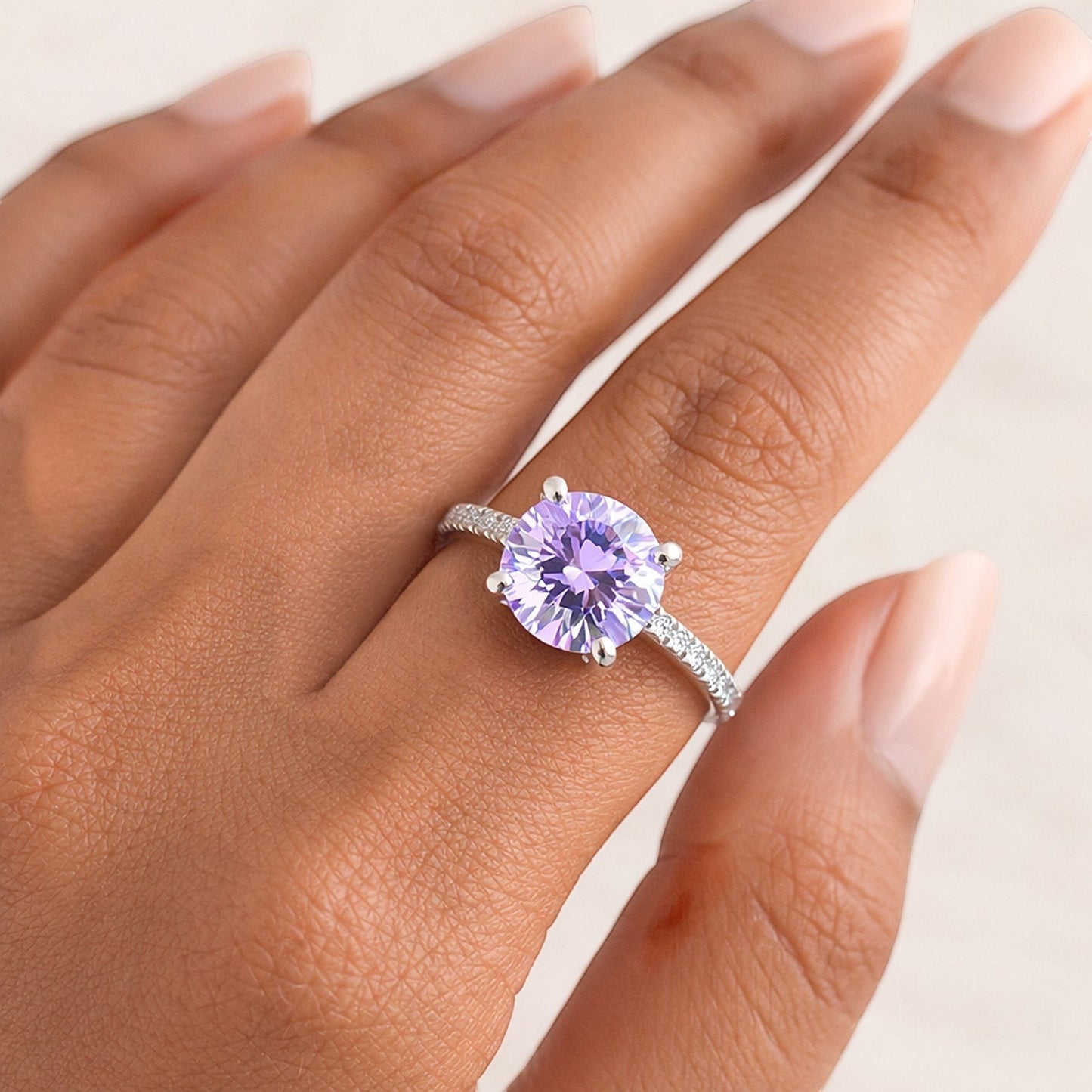 GEMHUB 2.00 Ct round cut blue lab grown diamond ring with VS1 clarity set in 18k gold vermeil on a sterling silver band.