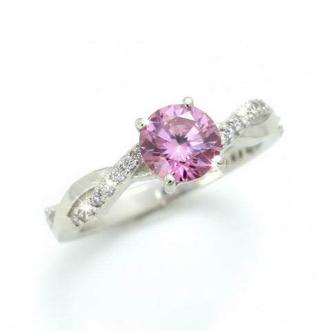 GEMHUB 1.25ct round pink moissanite solitaire ring with pave accent stones on a twisted band, 18K gold plated vermeil over sterling silver.