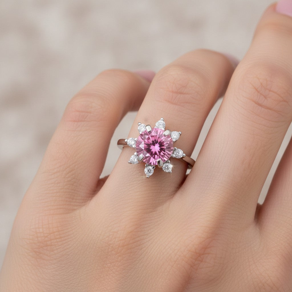 GEMHUB 2.5ct round pink moissanite solitaire ring with surrounding white accent stones in 18K gold plated sterling silver.
