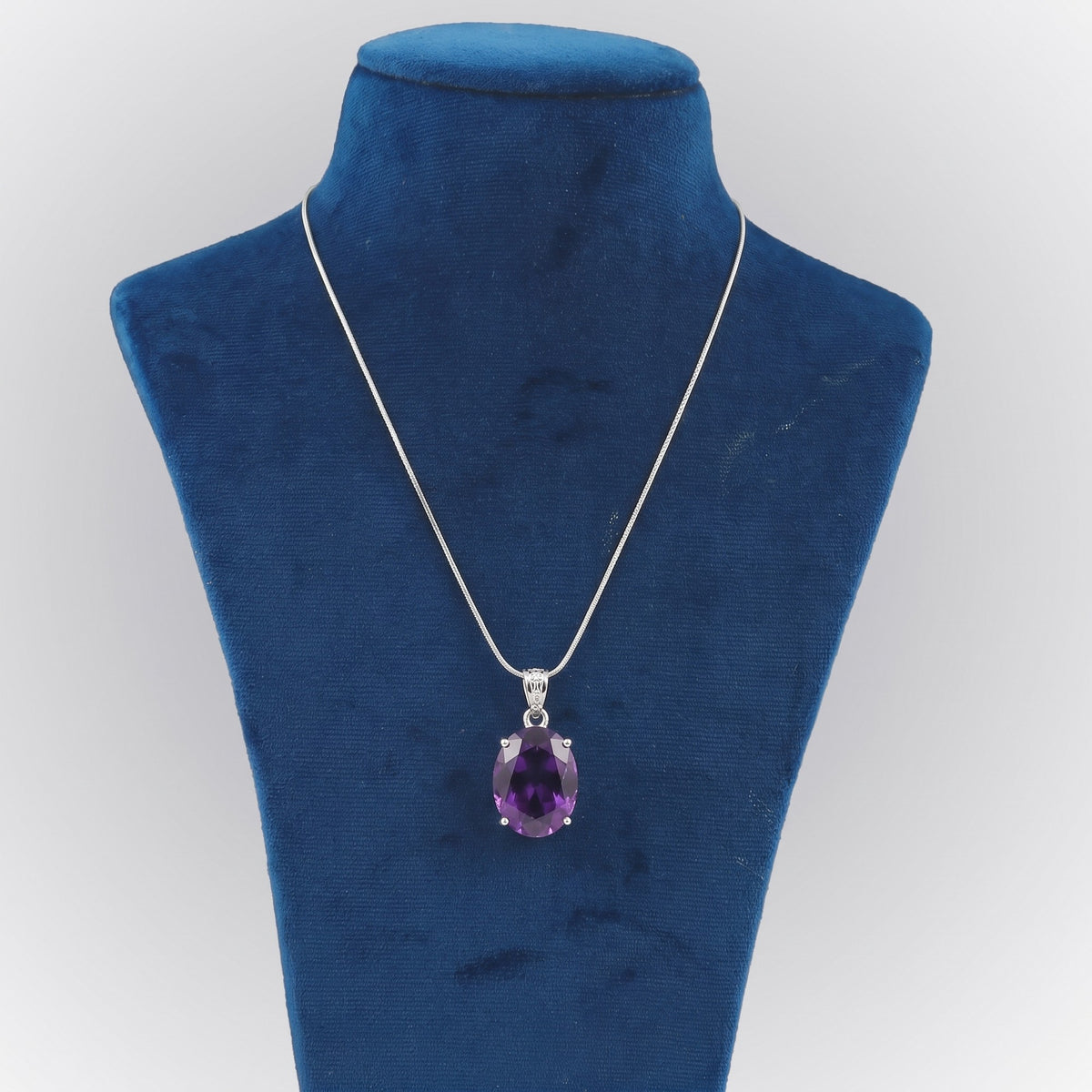 GEMHUB Violet Amethyst Oval 127 Ct lab-grown gemstone pendant on display bust (AI render)