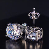 4.20ct white moissanite round studs - angled view showing faceting and polish