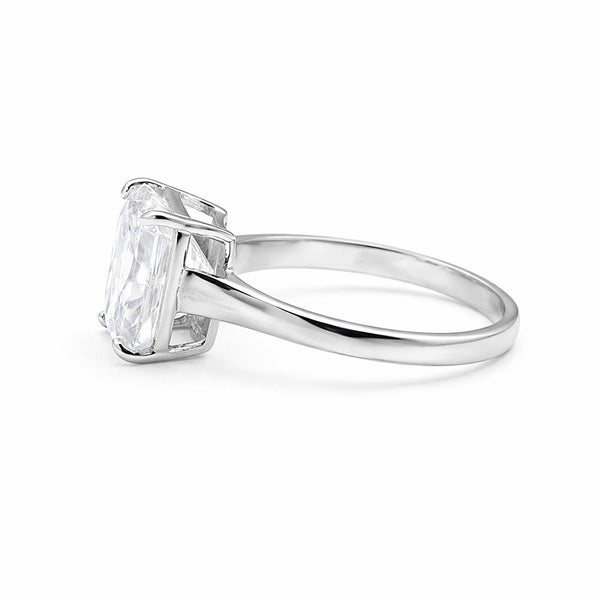 Side profile of 3 carat emerald diamond ring with gold vermeil east-west prongs