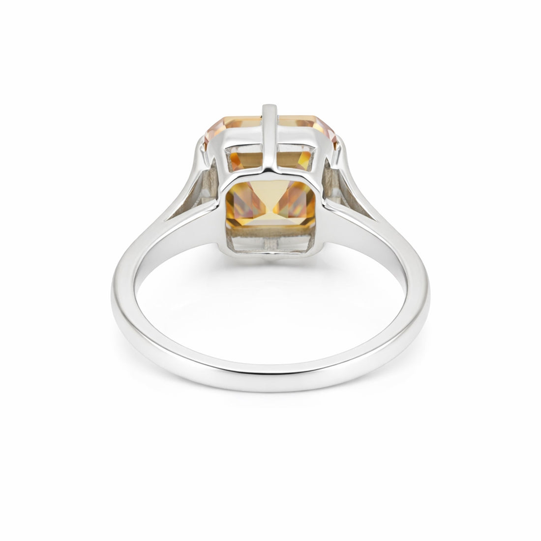 Detail of 18k gold vermeil prongs holding asscher diamond, top-down view