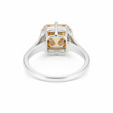 Detail of 18k gold vermeil prongs holding asscher diamond, top-down view