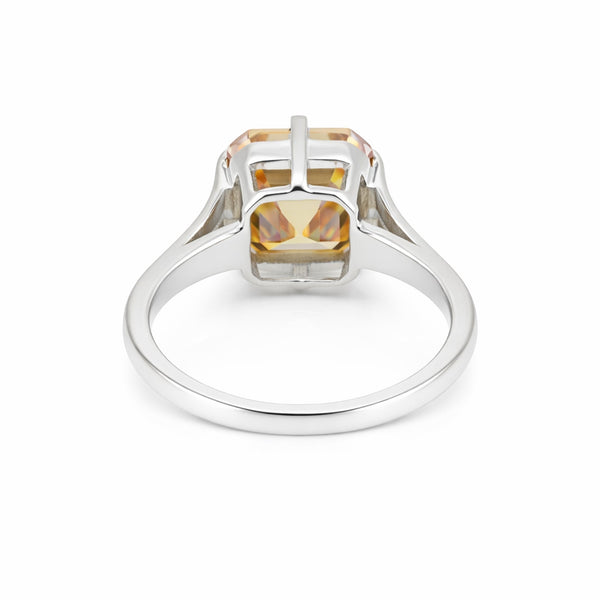 Detail of 18k gold vermeil prongs holding asscher diamond, top-down view