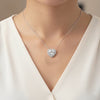 Heart cut lab diamond pendant with diamond halo of pavé-set accent stones