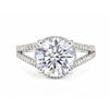 Close-up of round brilliant centre stone with pavé-set diamond accent stones