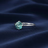 Top view of blue lab diamond showing ocean-blue saturation and round brilliance