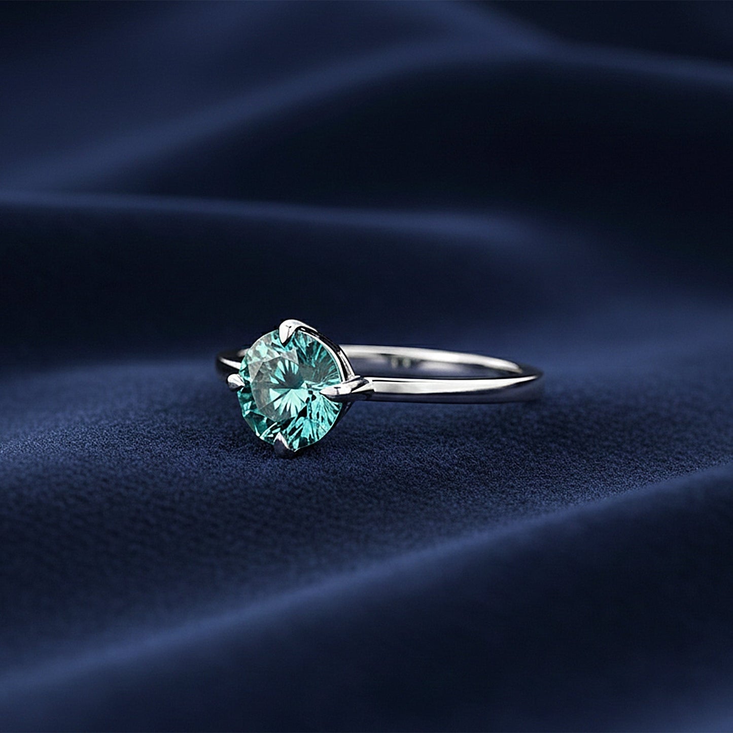 Top view of blue lab diamond showing ocean-blue saturation and round brilliance