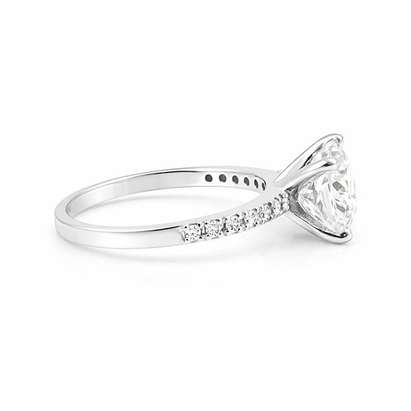 Cushion cut lab diamond ring worn on hand, classic vintage engagement style