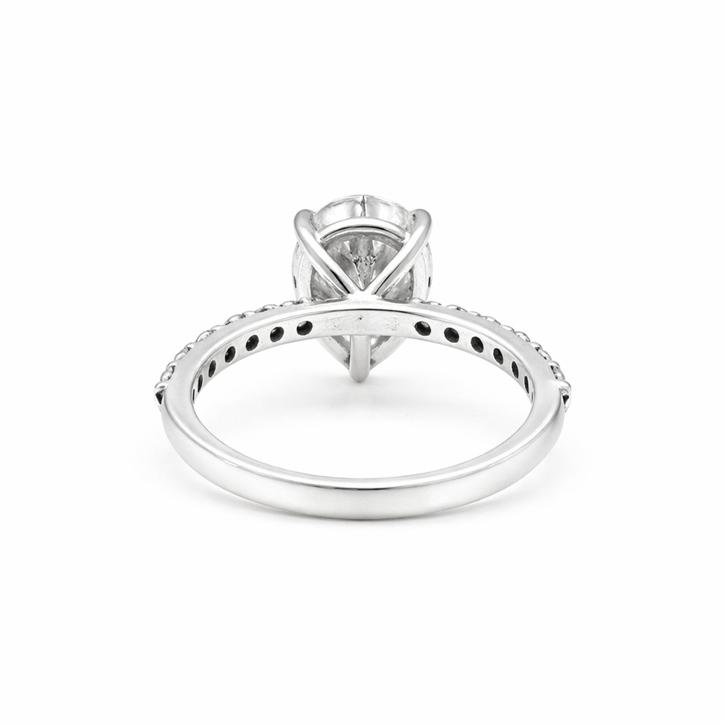 Pear-cut lab diamond ring worn on hand, elongating finger styling