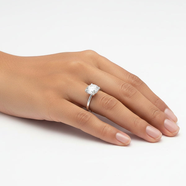 Side profile of cushion engagement ring with gold vermeil cathedral shank