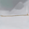 Underside of bezel tennis bracelet showing 14k yellow gold hallmark