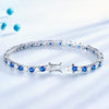14k white gold tennis bracelet with blue sapphires and round diamonds, full length