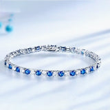 Close-up of alternating sapphire and diamond pattern on 14k white gold links