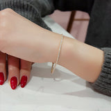 Diamond tennis bracelet worn on wrist, daily-wear refined gold jewellery