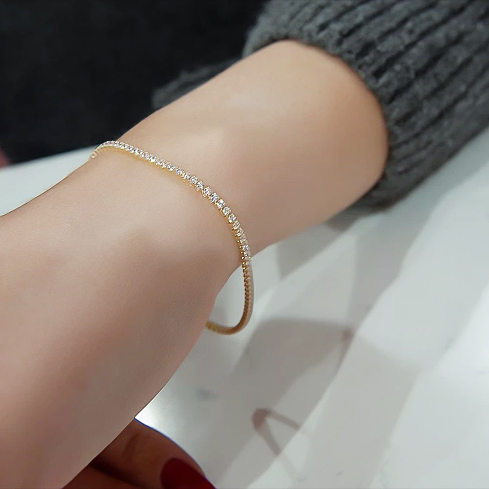Close-up of natural diamond link showing prong setting and round cut