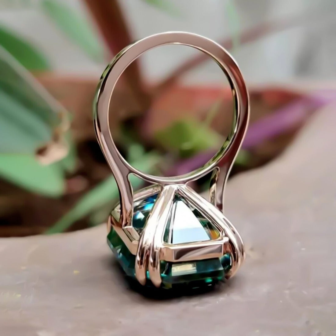 Lab grown green emerald solitaire ring, angled view showing stone depth and colour – GEMHUB