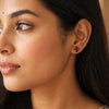 Pair of oval-cut natural red garnet earrings showing deep red colour and clarity