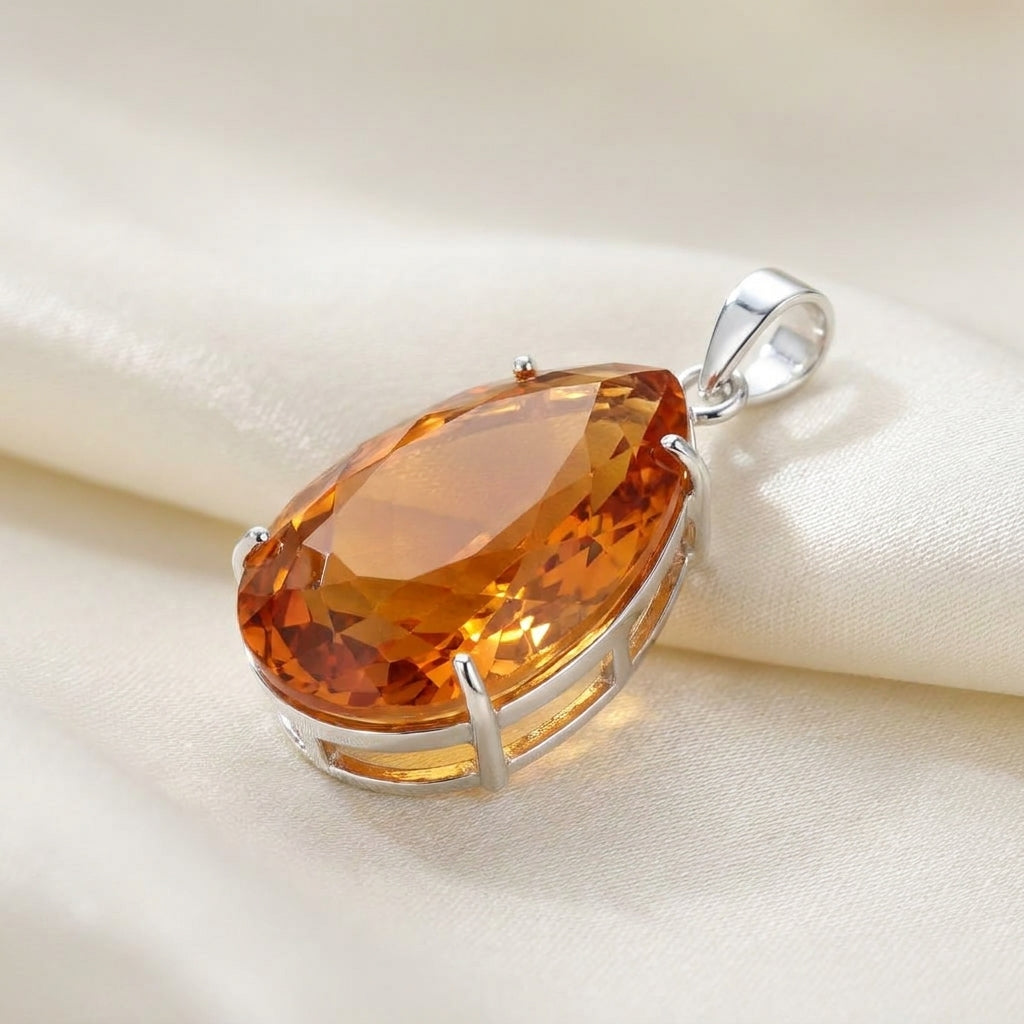 GEMHUB Yellow Citrine Pear 105 Ct pendant side view on silk (AI)