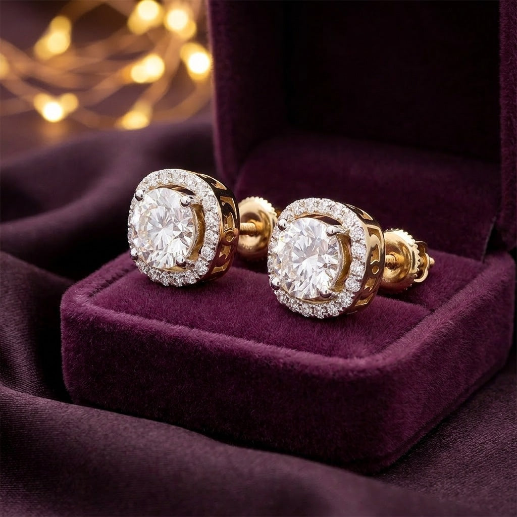 Pair of diamond halo studs in a plum velvet gift box