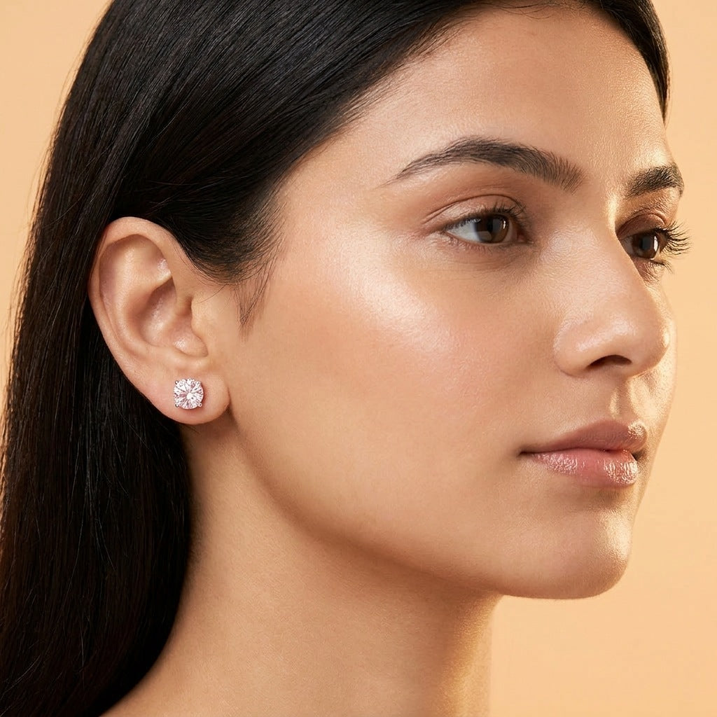 Pale pink moissanite stud worn on the ear