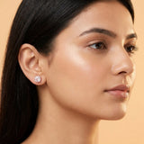 Pale pink moissanite stud worn on the ear