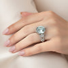 GEMHUB 5 Ct round cut blue lab grown diamond ring in 18k gold vermeil with pavé band and pear-shaped side stones.