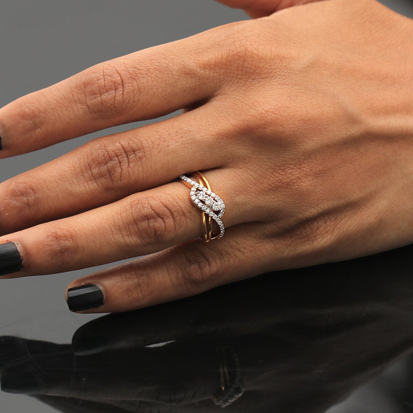 Detail of small round brilliant diamonds set in woven yellow gold band
