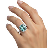 GEMHUB 5.00 Ct cushion cut blue lab grown diamond ring with VS1 clarity, set in 18k gold vermeil with a halo of smaller diamonds.