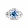 GEMHUB 3.50 Ct round cut blue lab-grown diamond ring with VS1 clarity, set in 18k gold vermeil with a halo of small white diamonds.