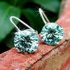GEMHUB 6.20 Ct round blue moissanite dangler earrings in 18K gold vermeil over 925 sterling silver.