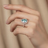 GEMHUB 4.70 Ct blue pear cut moissanite solitaire ring with diamond halo and band, set in gold vermeil.