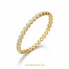 Side angle of 14k yellow gold bezel diamond bracelet with clasp visible