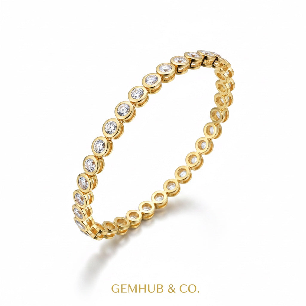 Side angle of 14k yellow gold bezel diamond bracelet with clasp visible