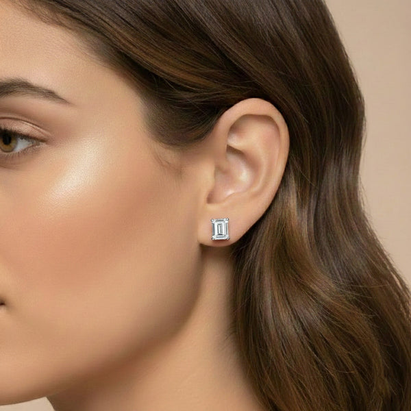 GEMHUB Emerald cut lab-grown diamond stud earrings in 950 platinum with screw backs.