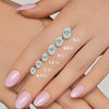 GEMHUB Oval lab-created diamonds in various carat sizes from 0.7 to 3 ct shown on a hand.