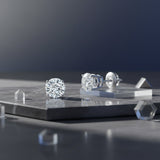 GEMHUB 1 Ct round lab-created diamond stud earrings in 950 platinum with screw backs. IGI certified.