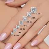 GEMHUB 1 Ct princess cut lab-created diamond earrings in 950 platinum with screw backs shown on a hand.