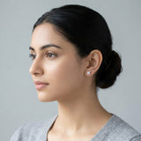 Princess cut lab-grown diamond stud worn on the ear