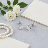 Princess cut diamond studs with pearls and a handwritten card