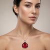 GEMHUB model-wearing (AI) Red Topaz Pear 90 Ct